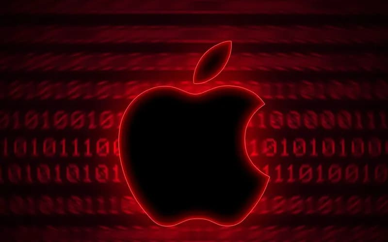 Kırmızı neon çizgili siyah Apple logosu, arka planda bulanık ikili kod satırları bulunan koyu kırmızı dijital görsel