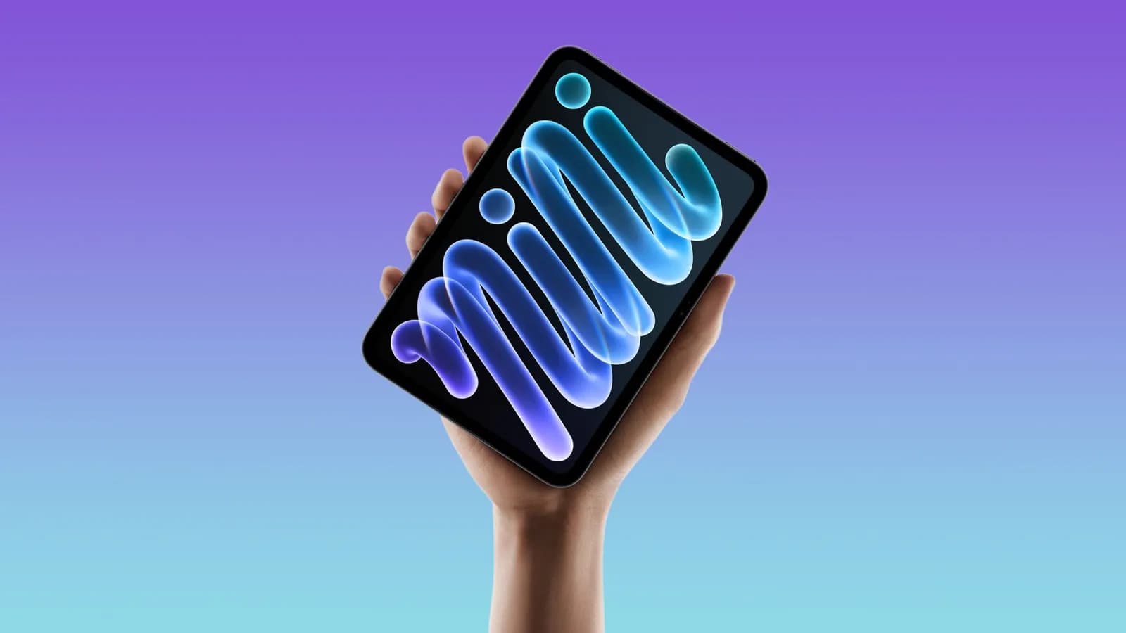 Hand holding a tablet with a colorful "mini" wallpaper on its screen, against a purple-blue gradient background