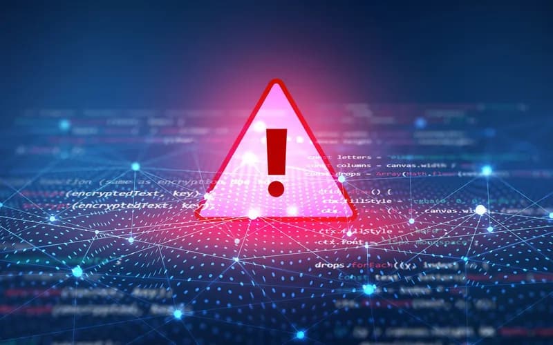 Glowing red-pink warning triangle with exclamation mark over code lines and network connections on a blue digital background