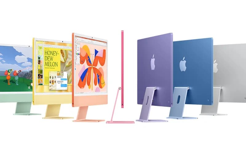 Yeşil, sarı, turuncu, pembe, mor, mavi ve gümüş renklerde yan yana dizilmiş renkli iMac bilgisayarlar