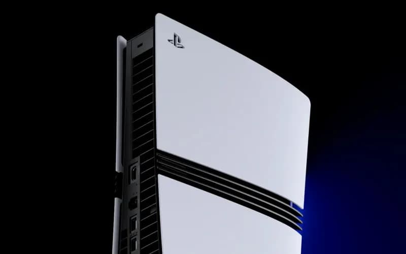 White and black PlayStation 5 Slim console standing upright against a black background, with the PlayStation logo on top